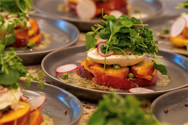 Fancy peach salad with mozzarella cheese and arugula