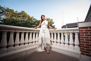 Bride in the corner of the patio railing